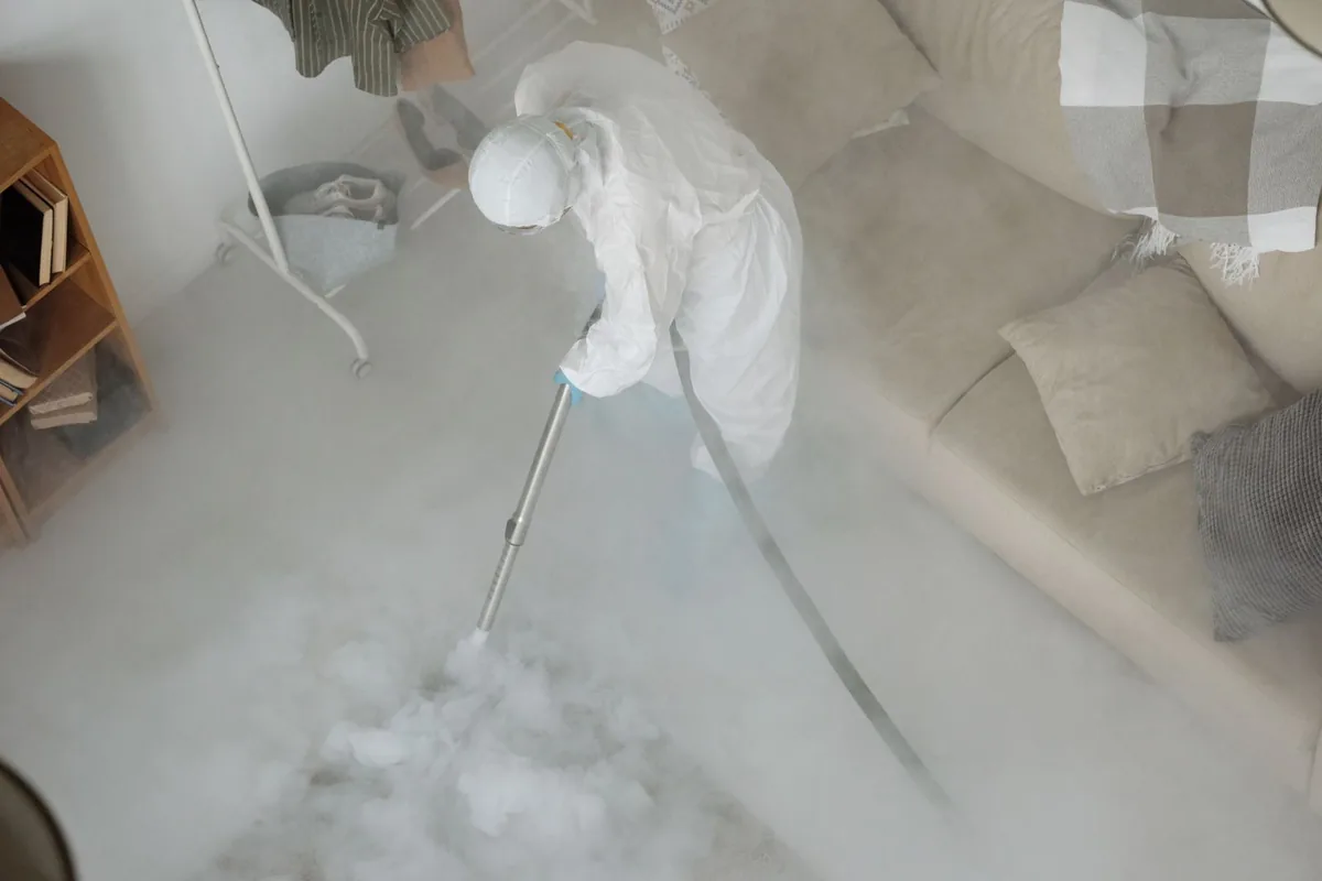 Biohazard cleanup technician in protective equipment, Island Heights, NJ